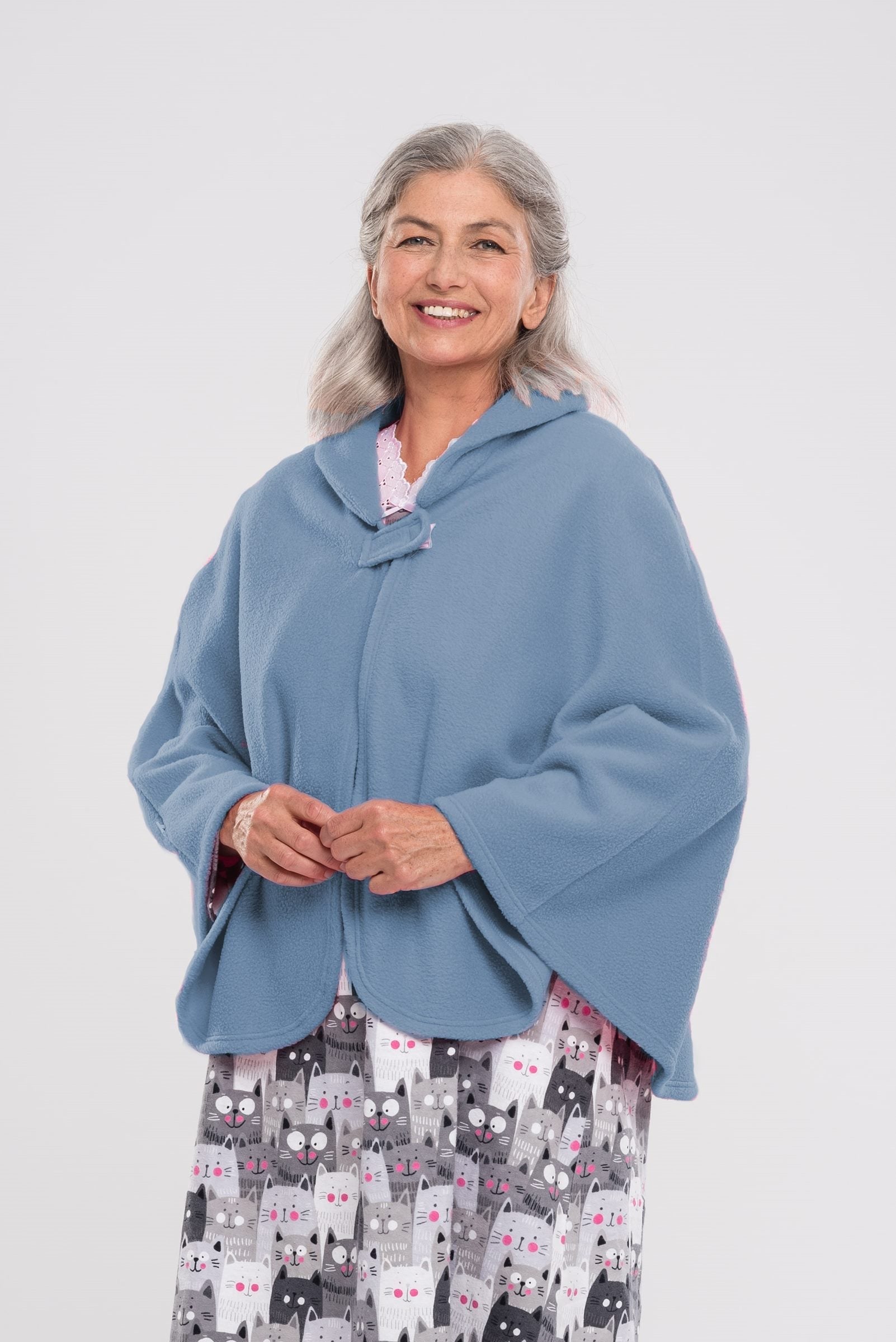Stay warm and cozy with our Cape in Polar Fleece. This versatile bedcoat doubles as a cape, perfect for added warmth and style. Made with soft polar fleece, it's not only comfortable but also comforting. Available in pastel or classic colors for a touch o