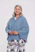 Stay warm and cozy with our Cape in Polar Fleece. This versatile bedcoat doubles as a cape, perfect for added warmth and style. Made with soft polar fleece, it's not only comfortable but also comforting. Available in pastel or classic colors for a touch o