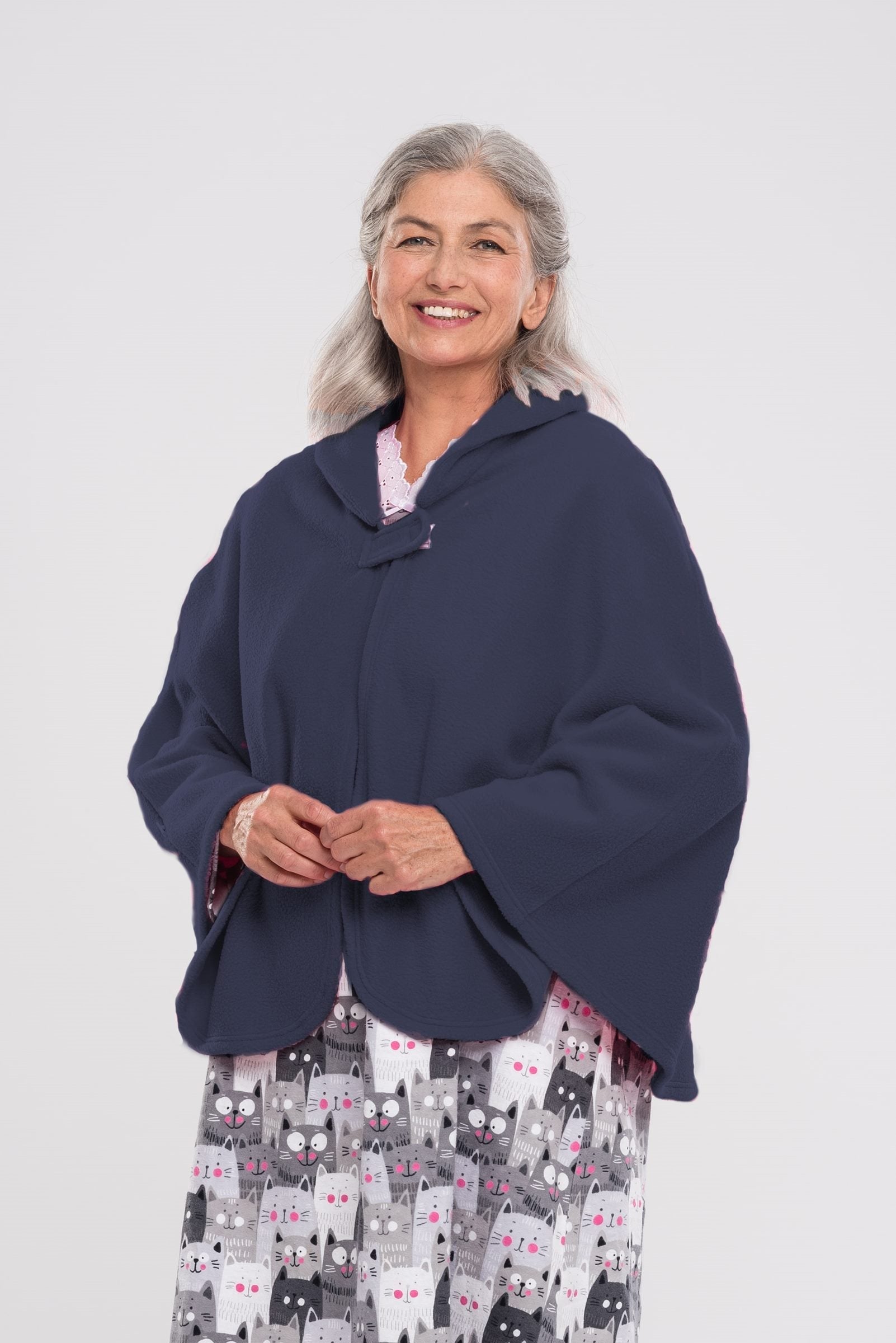 Stay warm and cozy with our Cape in Polar Fleece. This versatile bedcoat doubles as a cape, perfect for added warmth and style. Made with soft polar fleece, it's not only comfortable but also comforting. Available in pastel or classic colors for a touch o