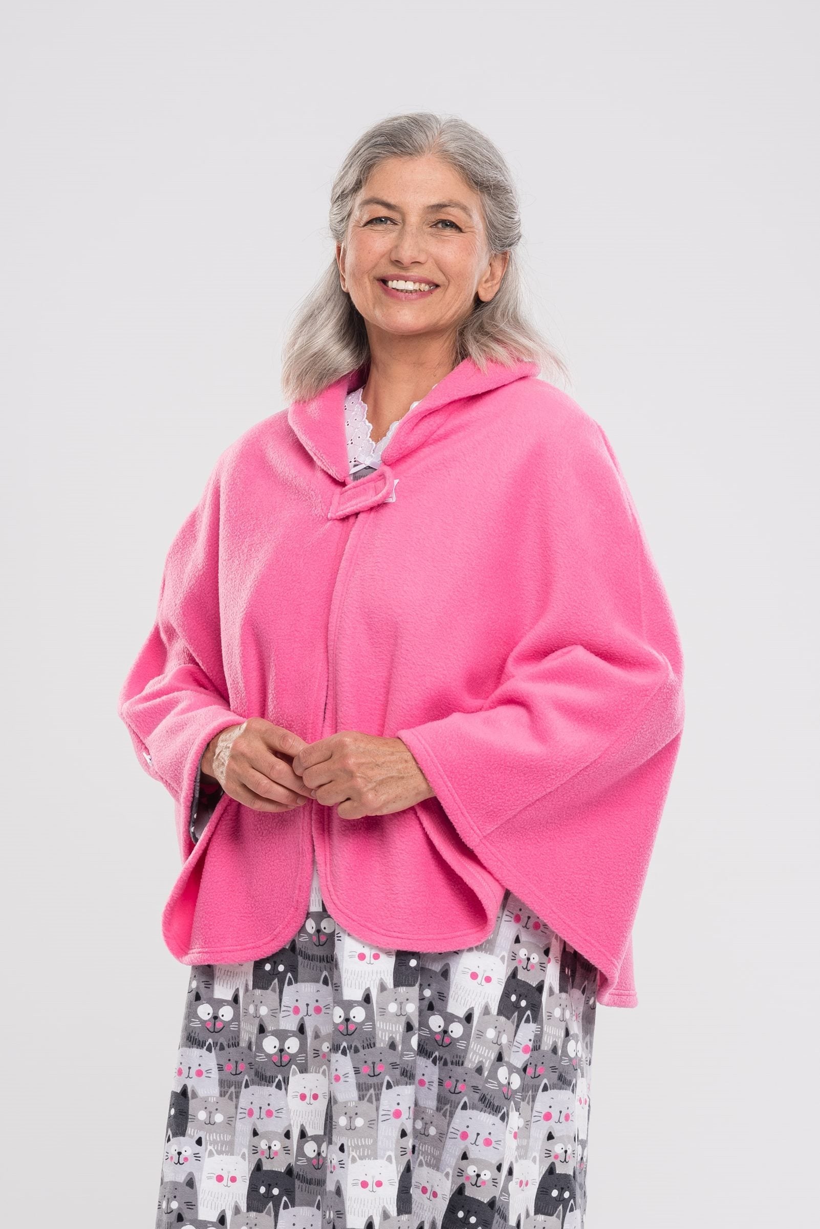 Stay warm and cozy with our Cape in Polar Fleece. This versatile bedcoat doubles as a cape, perfect for added warmth and style. Made with soft polar fleece, it's not only comfortable but also comforting. Available in pastel or classic colors for a touch o