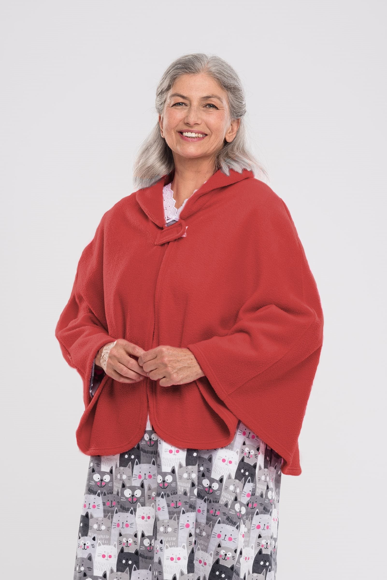Stay warm and cozy with our Cape in Polar Fleece. This versatile bedcoat doubles as a cape, perfect for added warmth and style. Made with soft polar fleece, it's not only comfortable but also comforting. Available in pastel or classic colors for a touch o