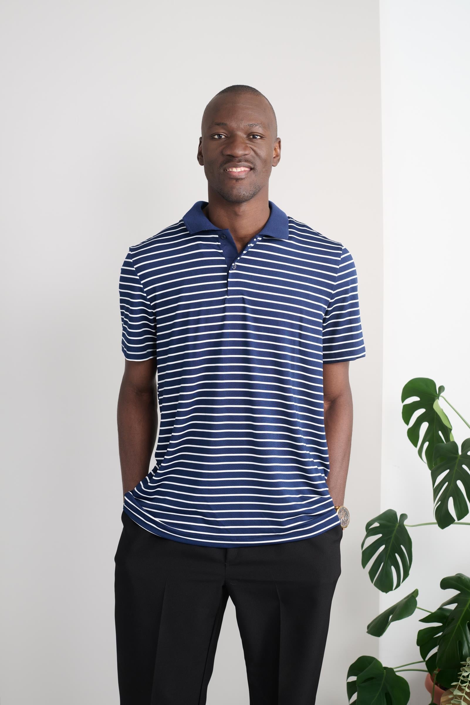 Designed for comfort and style, this adaptive polo is perfect for any occasion. The short sleeves and stretch knit fabric offer a relaxed fit, while the striped pattern in navy and white adds a touch of sophistication. Stay comfortable and look great with