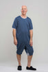 Adaptive short legs onesie designed for people suffering from dementia. A zipper on the back of the garment prevents the wearer from undressing.  A large, zippered crotch opening facilitates diaper changes.  Durable soft mesh knit dries quickly. Can be wo