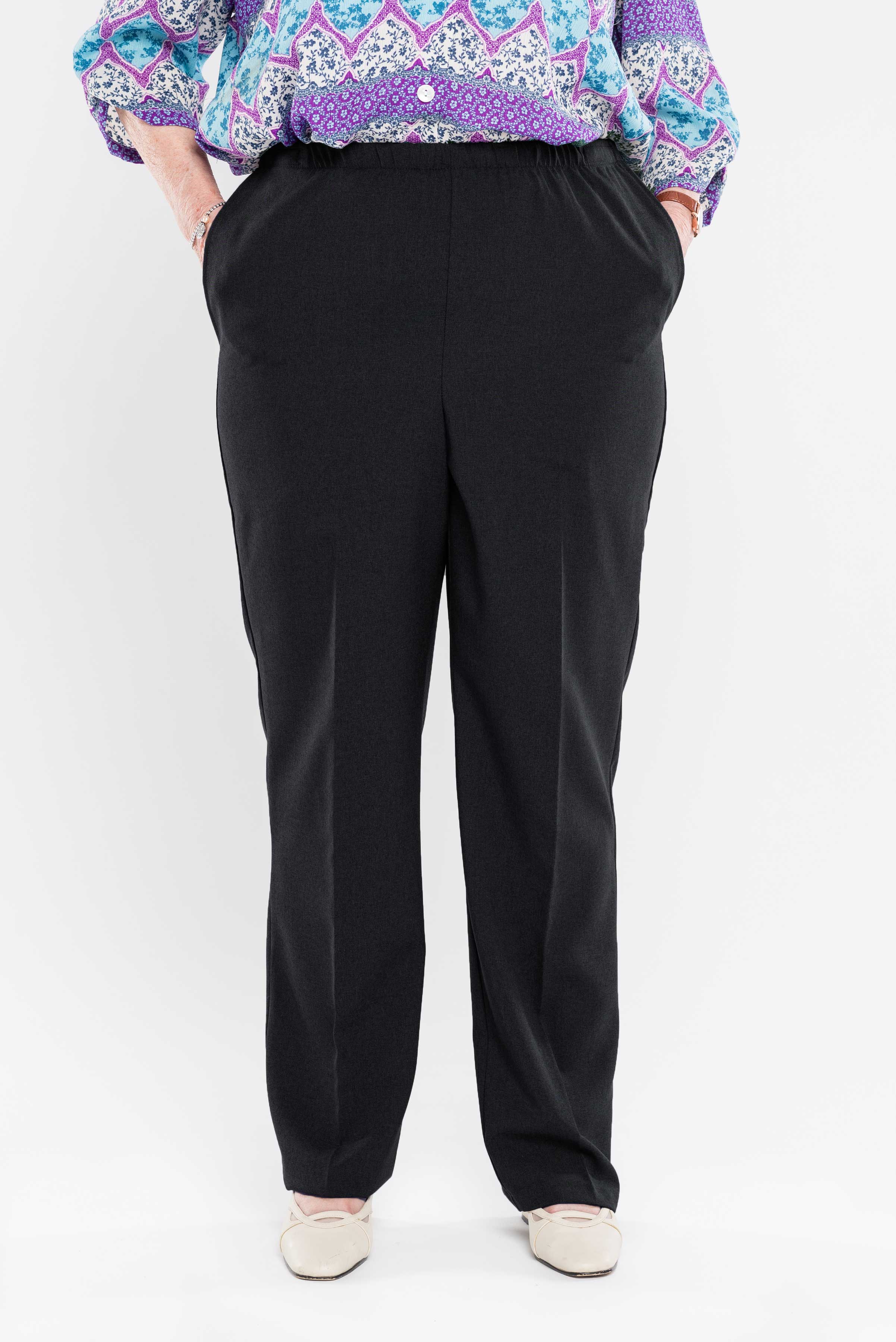 Enjoy effortless dressing with our adaptive pants featuring side openings and snap closures. Made with gabardine fabric, these women's pants are both stylish and easy to care for with their machine-washable polyester material. Simplify your day-to-day rou
