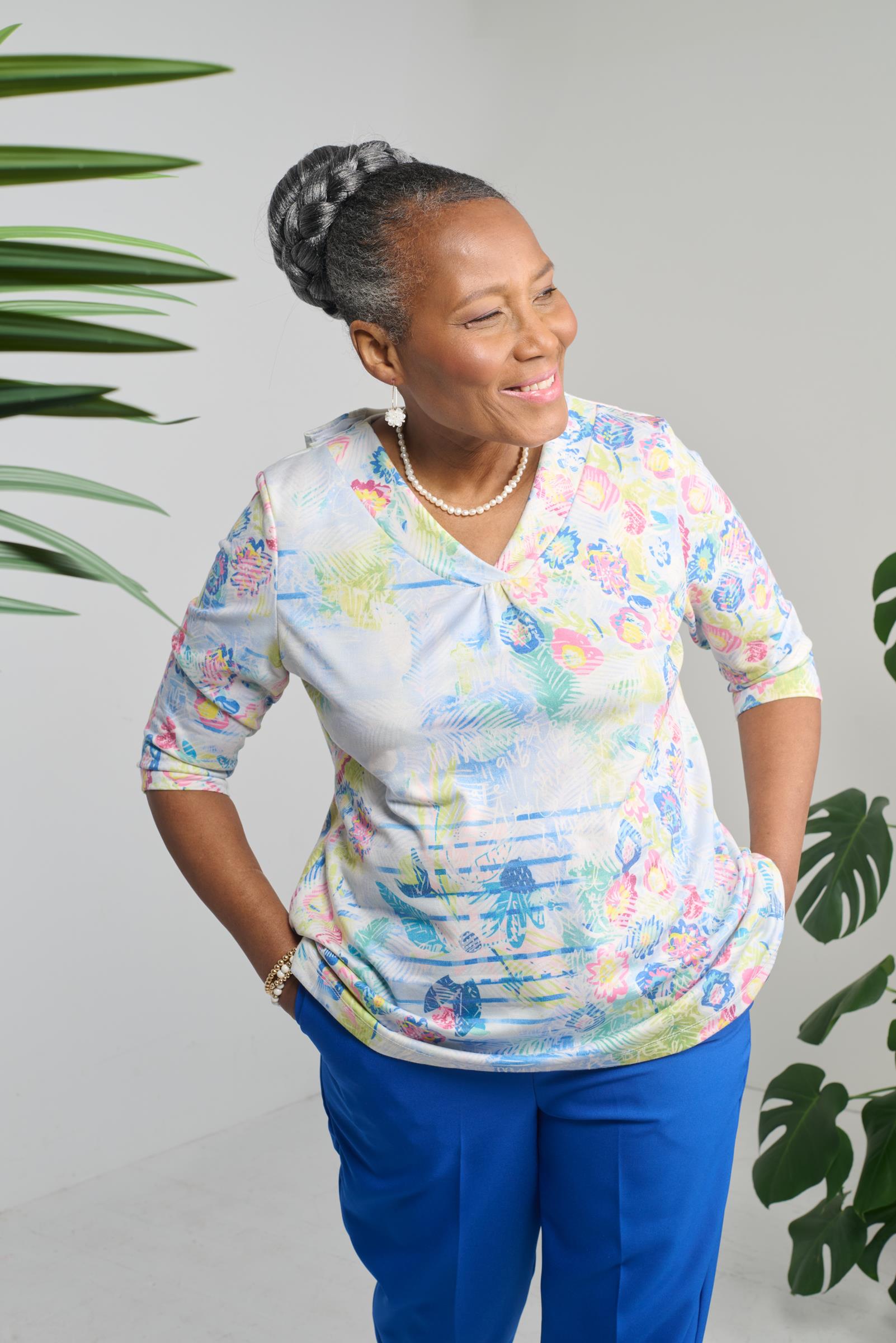 Effortlessly stylish and versatile, our adaptive top is a must-have for every wardrobe. This top features 3/4 sleeves and a V-neck for a flattering fit, while the soft knit fabric ensures ultimate comfort. Available in beautiful pastel colors, it's the pe