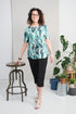 This adaptive basic top is designed with short sleeves and a stretch knit fabric for comfort and ease of movement. The round collar and glitter embellishments add a touch of style to any outfit. Designed to support those with limited mobility, this top ma