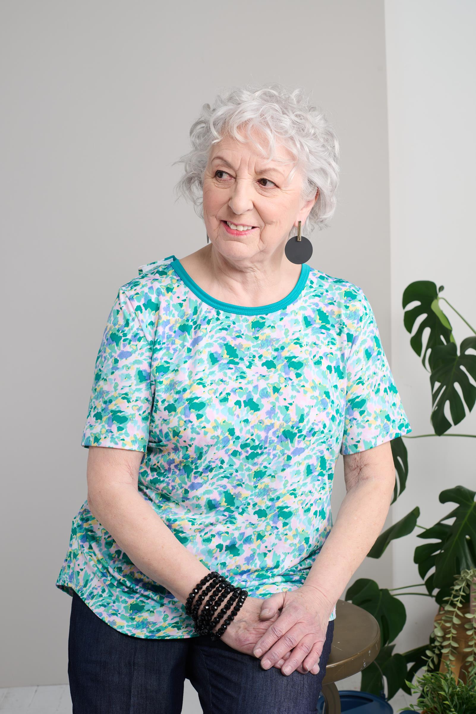 Stay comfortable and stylish with our Adaptive Basic Top. Short sleeves and stretch knit provide ease of movement, while the multiple pastel colors give you a variety of options to match your outfits. Perfect for any casual occasion.