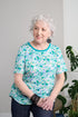 Stay comfortable and stylish with our Adaptive Basic Top. Short sleeves and stretch knit provide ease of movement, while the multiple pastel colors give you a variety of options to match your outfits. Perfect for any casual occasion.