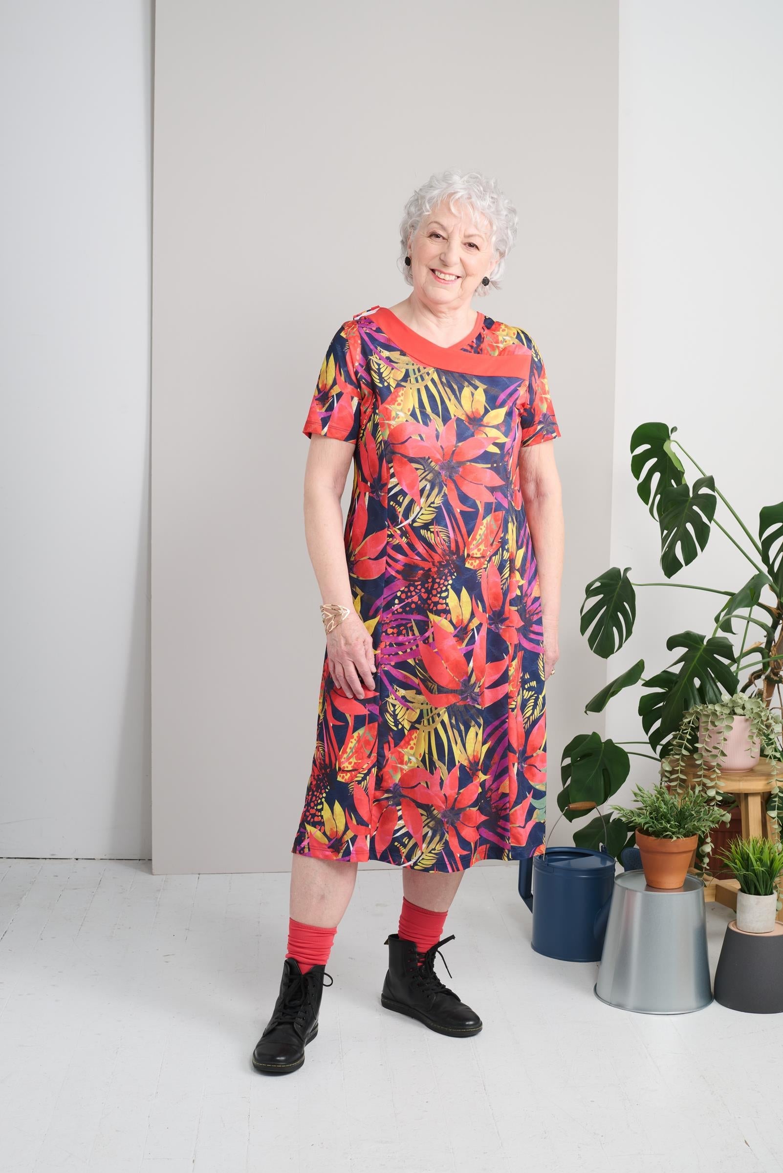 Expertly designed for those with mobility limitations, this adaptive dress makes getting dressed a breeze. Featuring a large opening and metal shoulder snaps, this dress allows for easy dressing and undressing. The stretch knit fabric and short sleeves pr