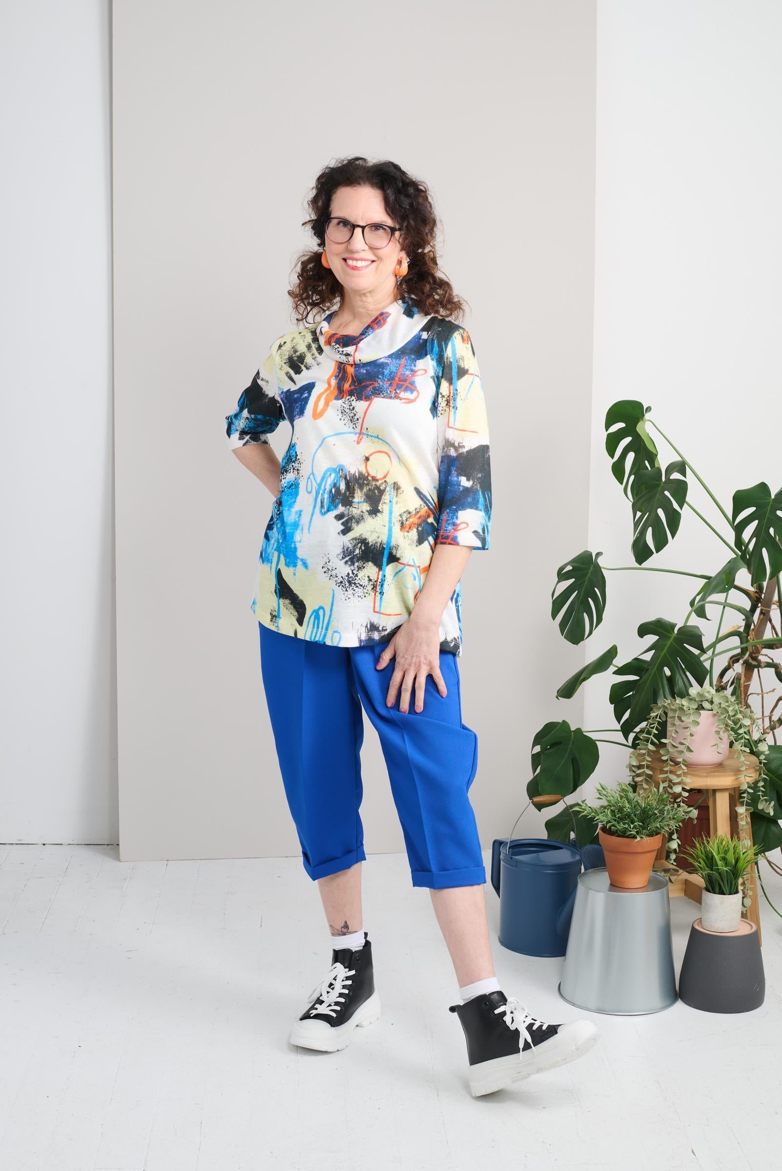 Stay comfortable and stylish with our Adaptive Top featuring a shawl neck and 3/4 sleeves. Made with light weight knit and a whimsical pattern, it's perfect for any occasion. Feel confident and supported in this approachable and casual top.
