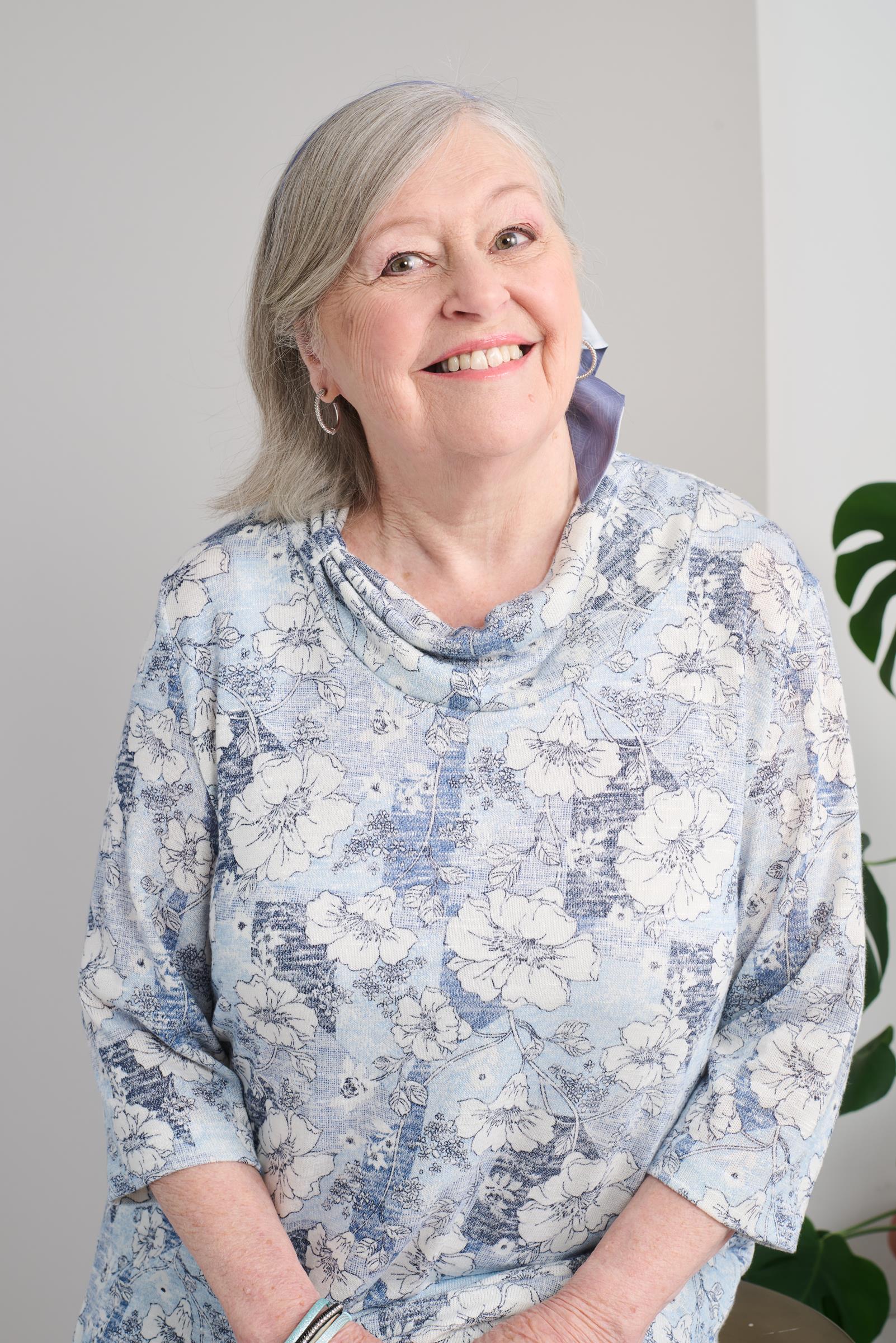 Stay comfortable and stylish with our adaptive top. The 3/4 sleeves are perfect for year-round wear, and the light weight knit will keep you feeling light and breezy. Plus, the beautiful flower pattern adds a touch of elegance to your wardrobe.